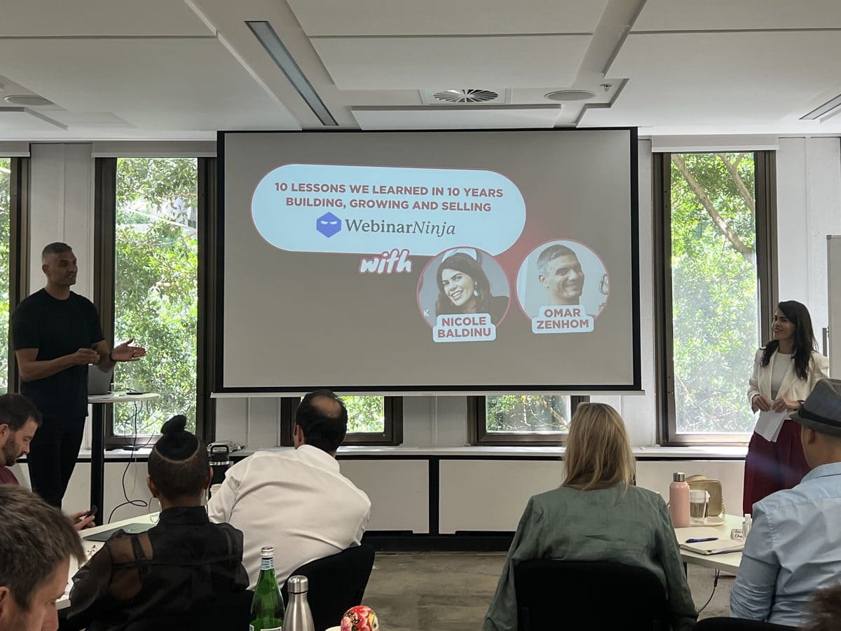 Omar and Nicole presenting to founders at a previous workshop